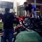 Anggota Polsek Sokobanah menurunkan motor yang terlibat aksi balap liar.