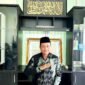 Kepala Kantor Kementerian Haji dan Umrah (KHU) Pamekasan Abdul Halim saat ditemui di ruang kerjanya (LAILIYATUN NURIYAH/KLIK MADURA).