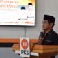 Ketua DPD PKS Pamekasan, Mohammad Alim saat menyampaikan sambutan pada kegiatan Khotmil Quran. (LAILIYATUN NURIYAH / KLIKMADURA)