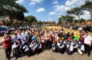 Siswa baru SRMP 29 Pamekasan berfoto bersama Kepala Dinsos Pamekasan Herman Hidayat Santoso dan Kepala SRMP 29 Pamekasan Aisyah Minarni Mukti sebelum berangkat ke SR Terintegrasi 1 Sampang (ISTIMEWA).