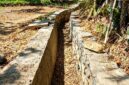 Kondisi proyek Program Percepatan Peningkatan Tata Guna Air Irigasi (P3-TGAI) di Desa Anggersek, Kecamatan Camplong, Kabupaten Sampang. (ALI MUCHTAR / KLIKMADURA)