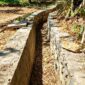 Kondisi proyek Program Percepatan Peningkatan Tata Guna Air Irigasi (P3-TGAI) di Desa Anggersek, Kecamatan Camplong, Kabupaten Sampang. (ALI MUCHTAR / KLIKMADURA)